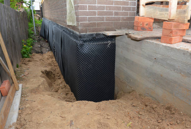 SJ Waterproofing Pros technician performing targeted Waterproofing assessment in Bloomington Springs, TN